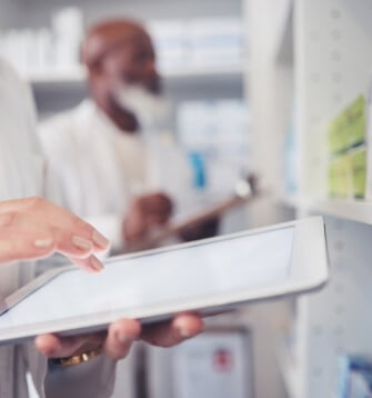 Healthcare provider reviewing patient data on tablet